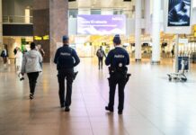 Drone Sightings Cause Major Disruptions at Brussels Airport, Flights Diverted Across Europe Passengers waiting for updates at Brussels Airport following Tuesday’s drone-related air traffic suspension. Credit: Belga/Emile Windal