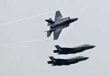 Belgium Defends F-35 Purchases Amid Rising European Defence Autonomy Debate US-made F-35 fighter jets perform aerial display during official ceremony at Florennes Air Base attended by Belgian leadership and military officials