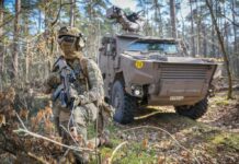Belgium Approves Major Military Expansion Plan Amid Mixed Local Reactions Fedasil sign at Koksijde military base symbolises transition from refugee centre to defence infrastructure under Belgium’s expansion plan. Credit: Belga. Source: The Brussels Times